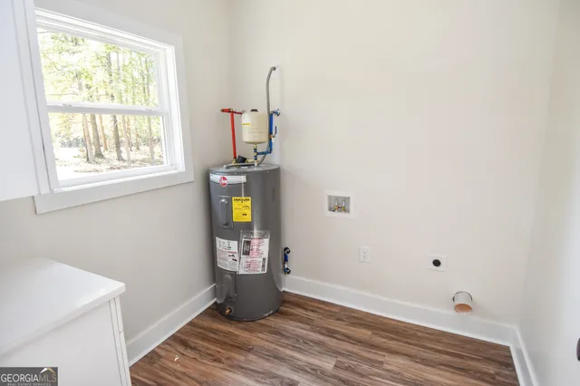 a view of a house with a tree in the background