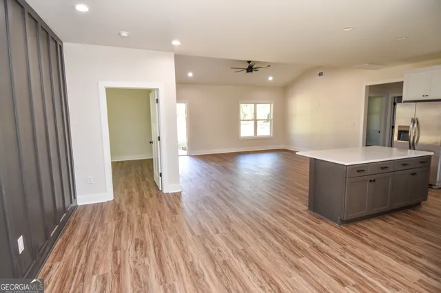 an aerial view of a house with mountain view