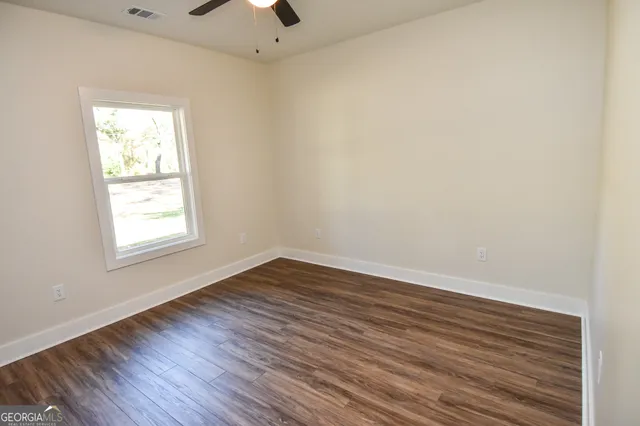 a view of a tree in a yard