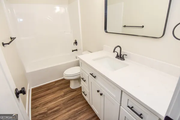 a view of a garden with a house