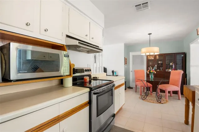 a kitchen with a stove and a microwave