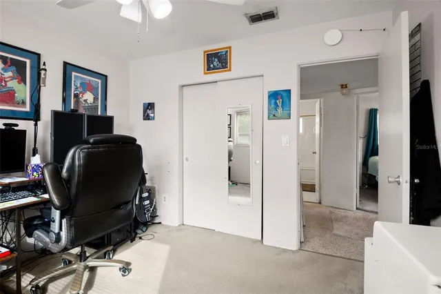 a view of a workspace with furniture and a livingroom
