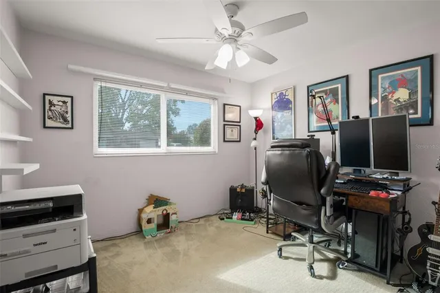 a room with furniture and musical instruments