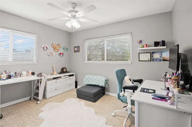 a workspace with furniture and a window