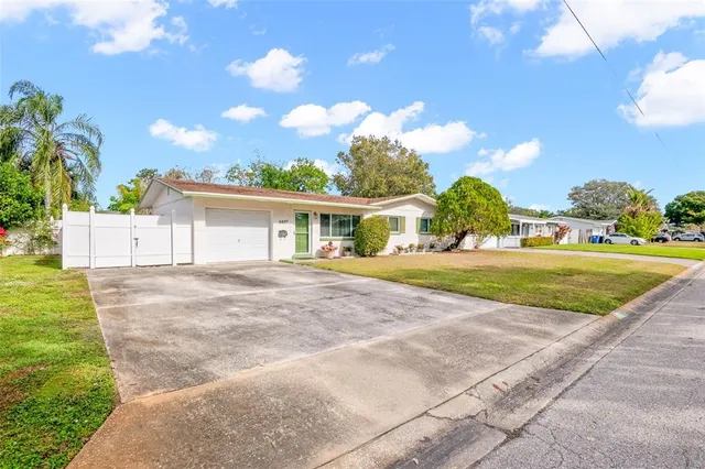 a view of house with yard and outdoor space