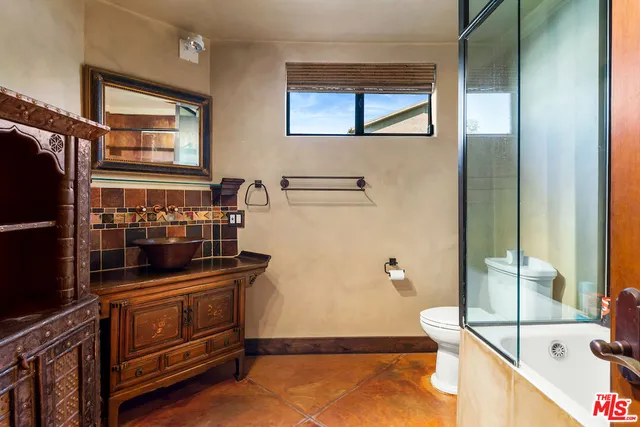 a bathroom with a tub and a sink