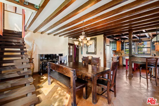a view of a dining room with furniture wooden floor and a rug
