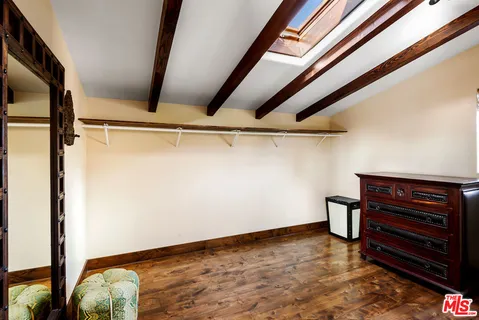 a view of room with wooden floor