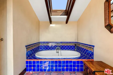 a view of a room with wooden staircase and door