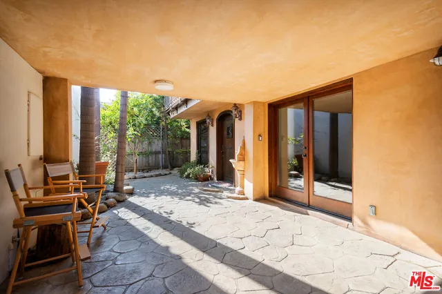 a view of kitchen with furniture and wooden floor