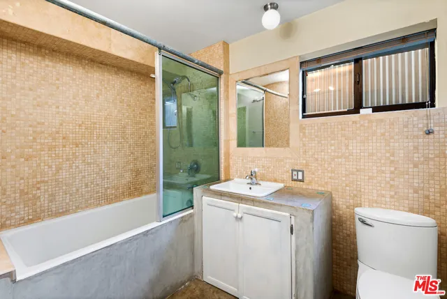 a view of a chair and table in the balcony