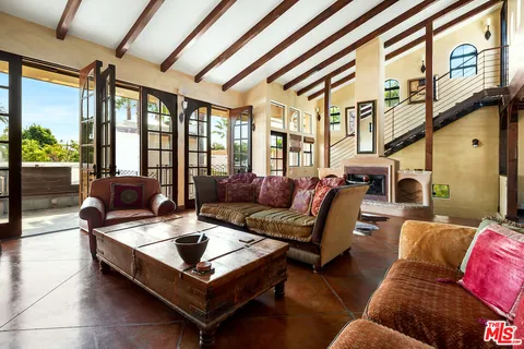 a living room with furniture or couch and a large window