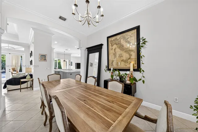 a kitchen with stainless steel appliances a stove a sink a microwave a refrigerator and cabinets