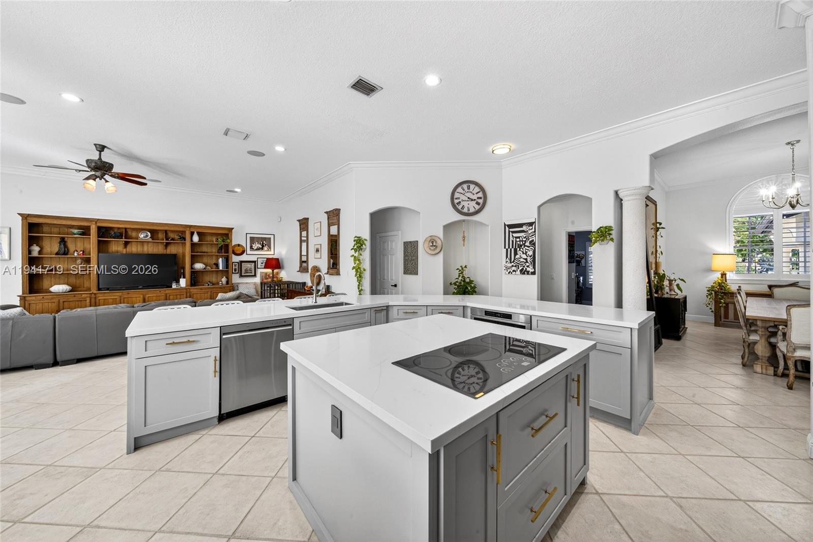 12530 Southwest 96th Court Miami, FL 33176 - Photo 20 of 82 a kitchen that has a lot of cabinets in it and wooden floors