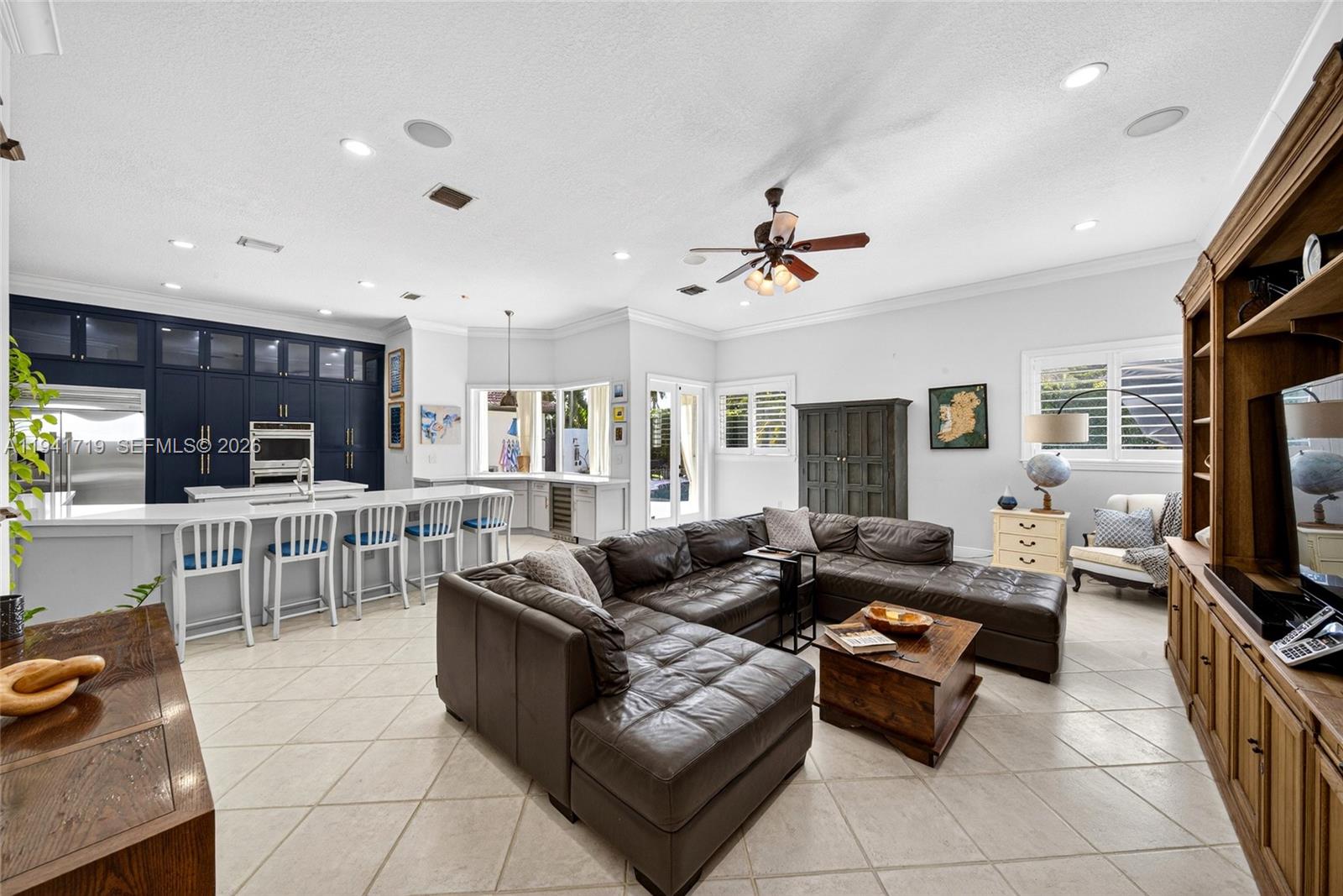 12530 Southwest 96th Court Miami, FL 33176 - Photo 26 of 82 a living room with furniture and a flat screen tv