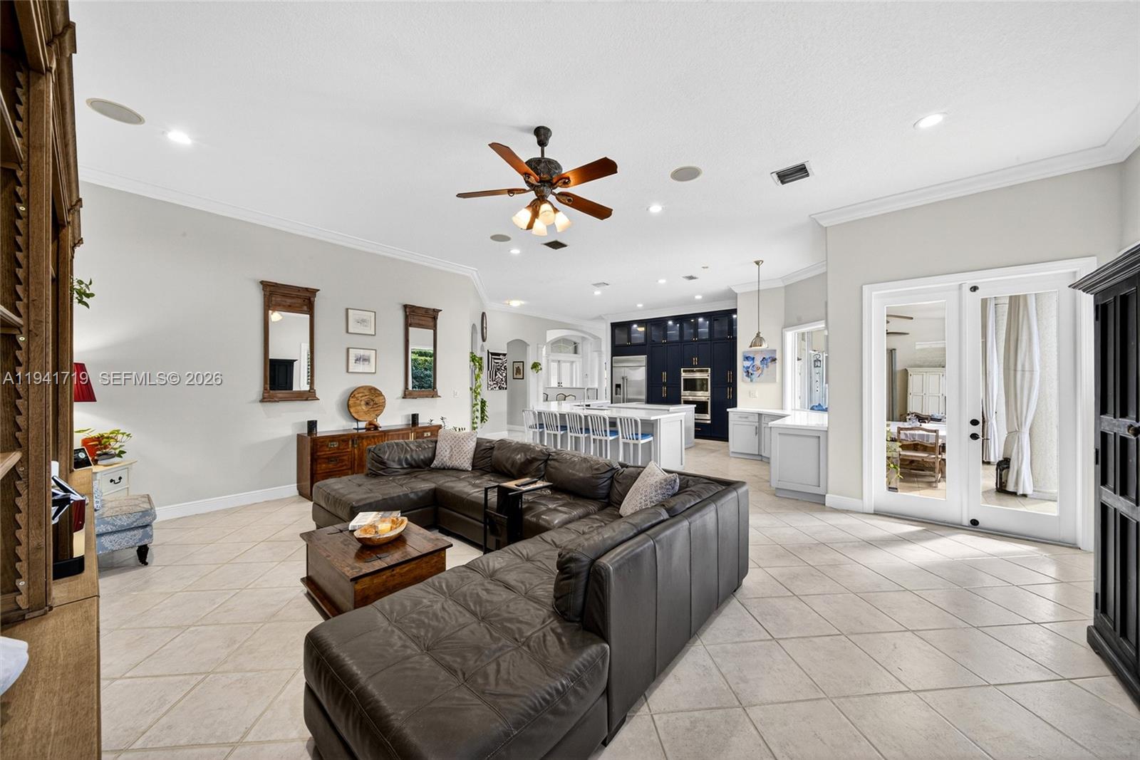12530 Southwest 96th Court Miami, FL 33176 - Photo 30 of 82 a living room with furniture a dining table and chairs with the kitchen view