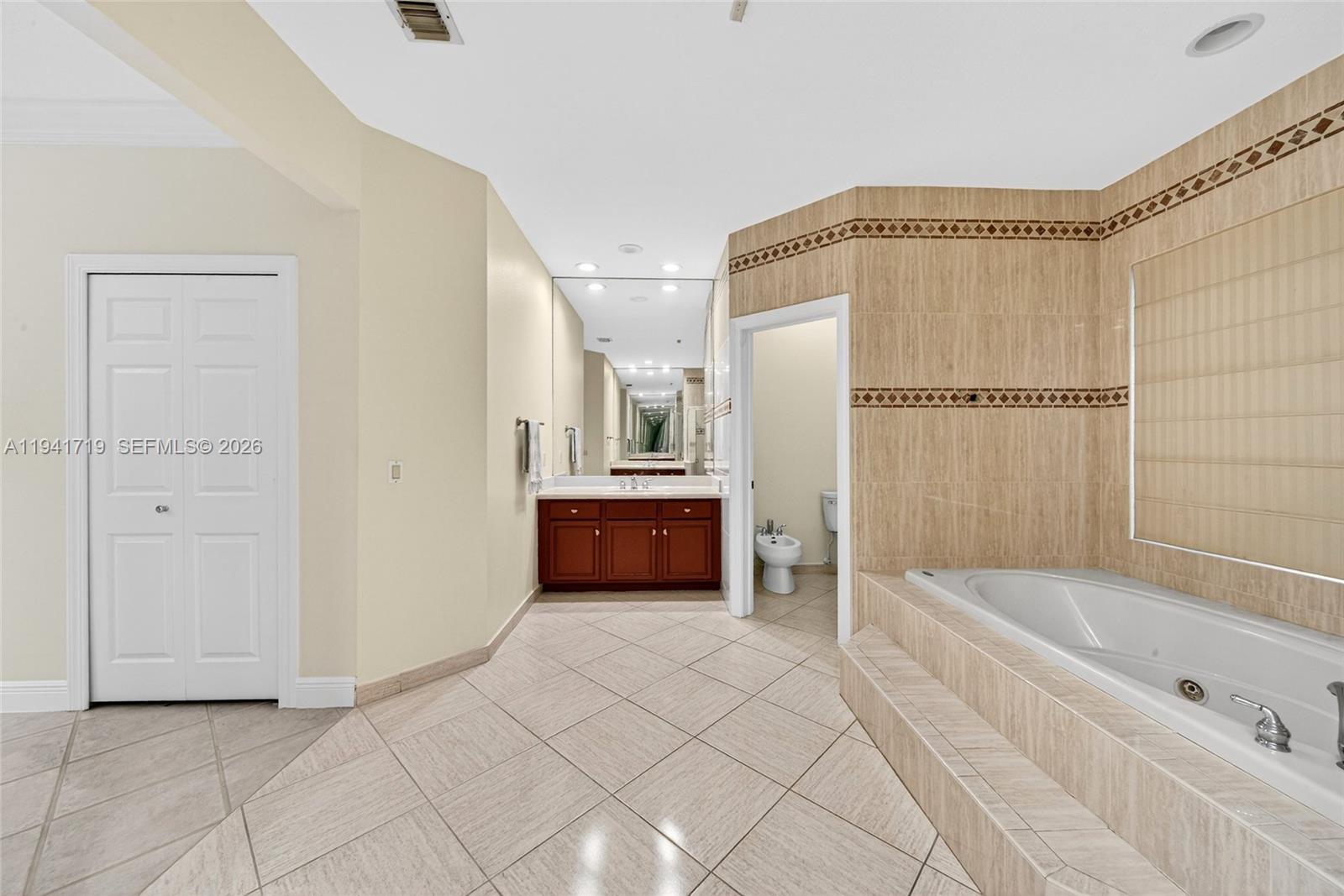 12530 Southwest 96th Court Miami, FL 33176 - Photo 40 of 82 a spacious bathroom with a tub and a shower