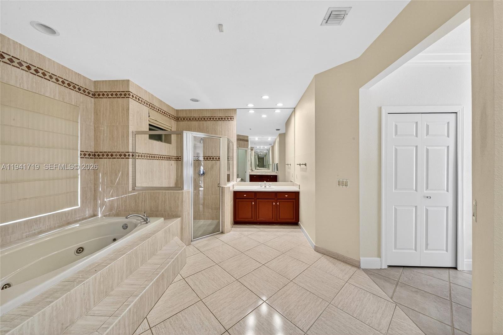 12530 Southwest 96th Court Miami, FL 33176 - Photo 41 of 82 a spacious bathroom with a tub and a shower