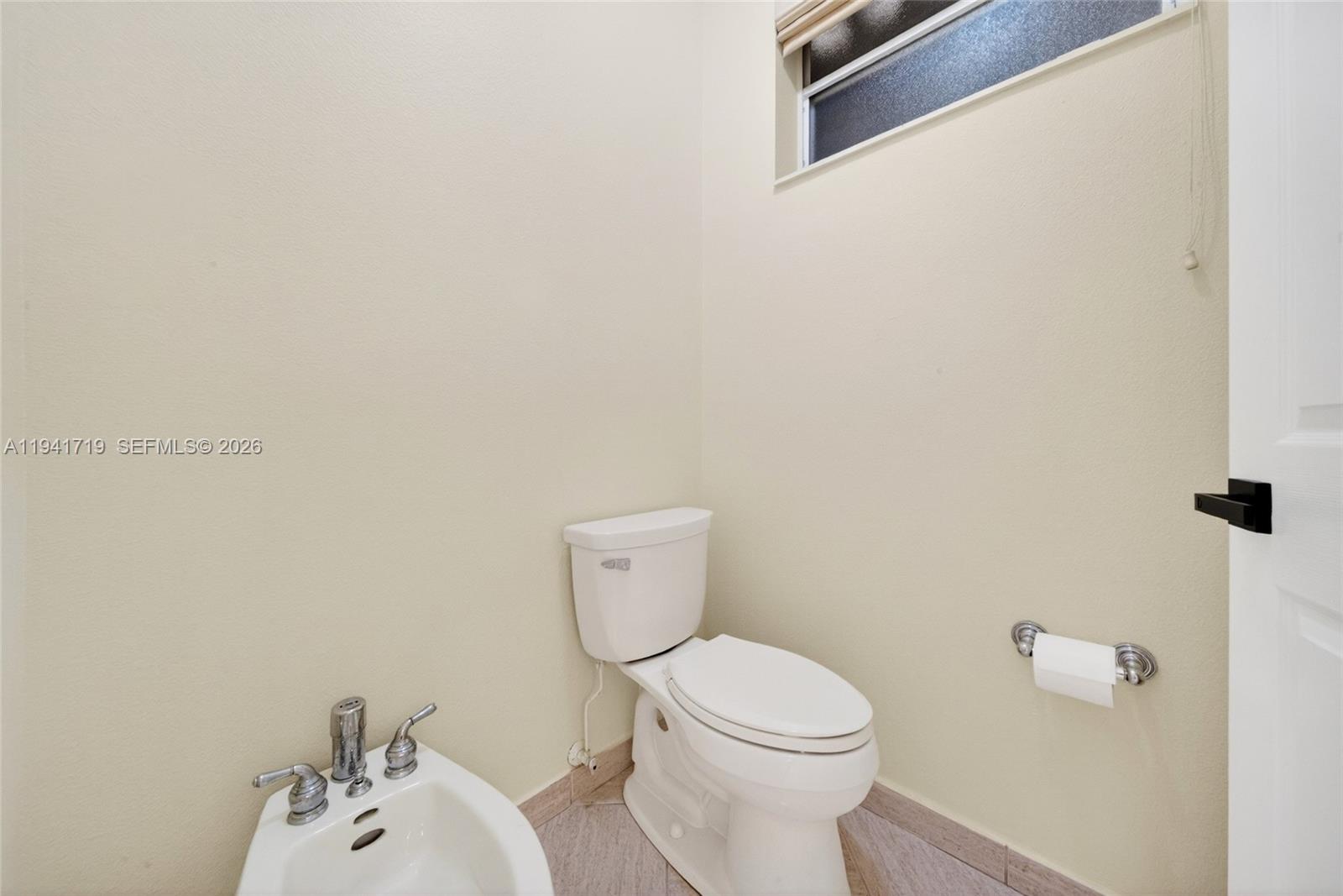 12530 Southwest 96th Court Miami, FL 33176 - Photo 42 of 82 a bathroom with a toilet and a sink