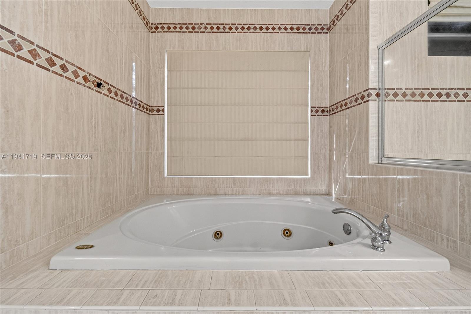 12530 Southwest 96th Court Miami, FL 33176 - Photo 43 of 82 a bathroom with a bath tub and a shower