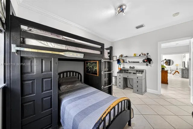 a view of swimming pool with seating area and palm tree