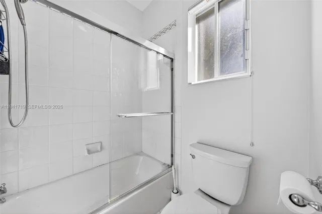 a view of a swimming pool with a yard