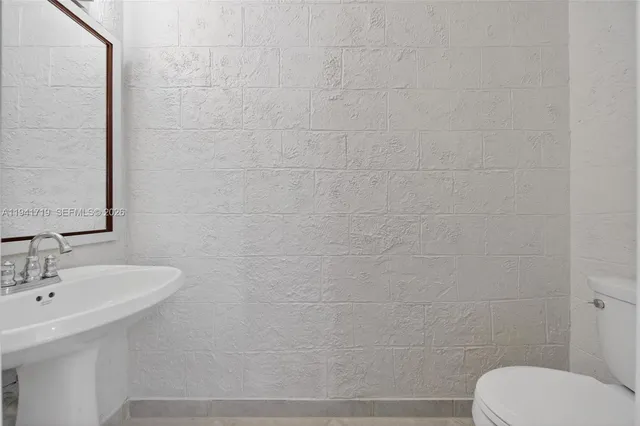 a view of a house with swimming pool and sitting area