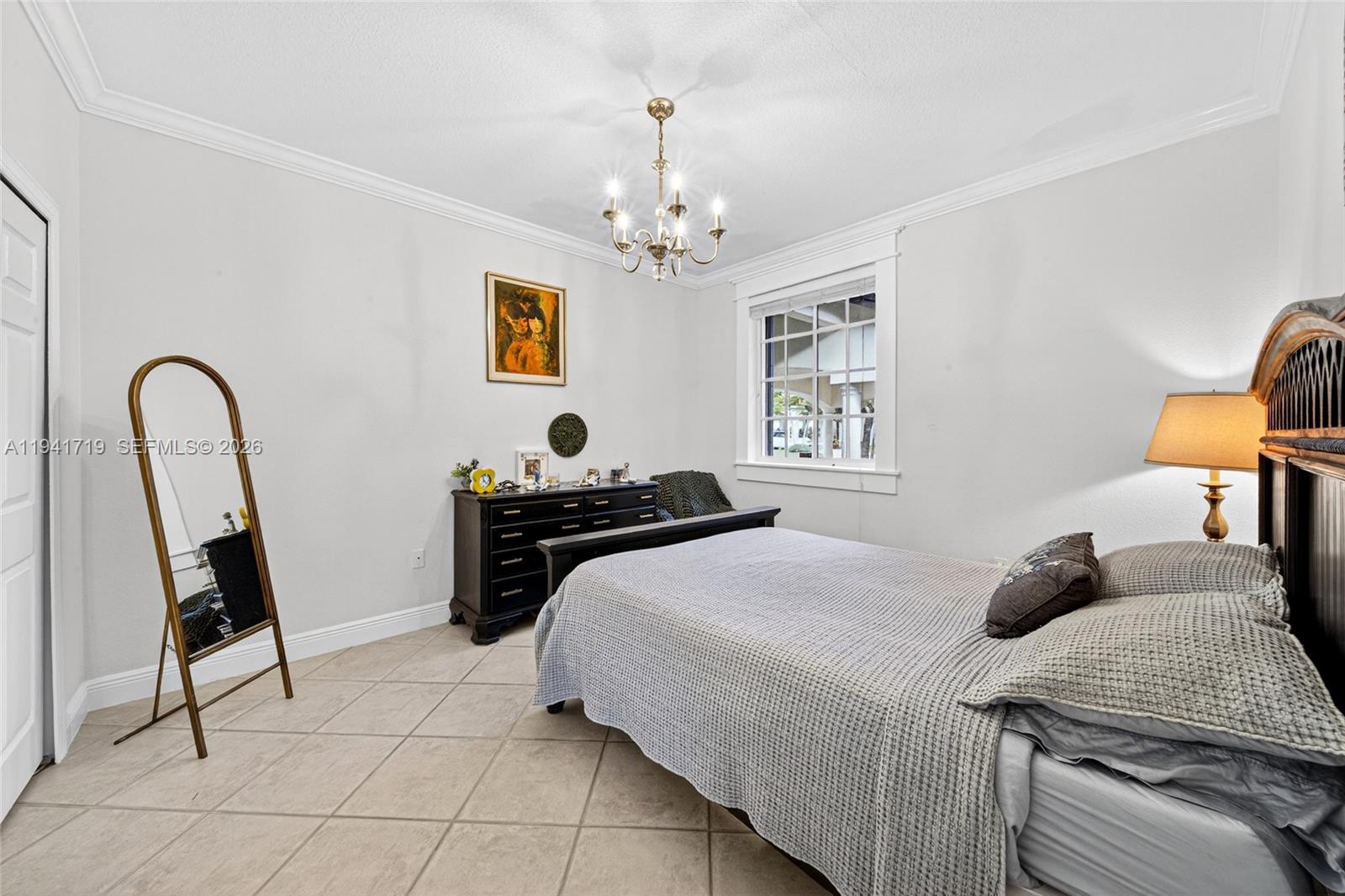 12530 Southwest 96th Court Miami, FL 33176 - Photo 51 of 82 a bedroom with a bed and a window