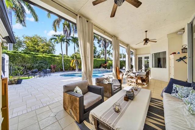 a view of a swimming pool with an outdoor space and seating area