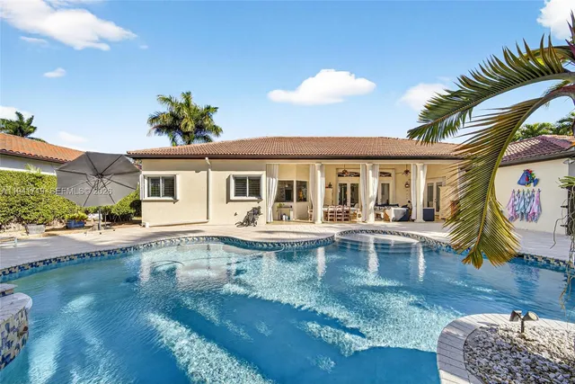 a view of a yard with plants and a trees