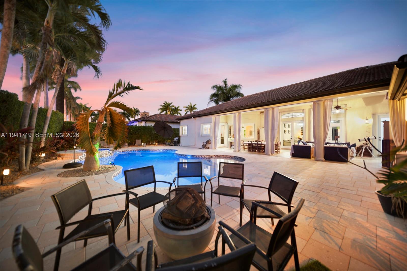 12530 Southwest 96th Court Miami, FL 33176 - Photo 66 of 82 a view of a dining room with furniture and wooden floor