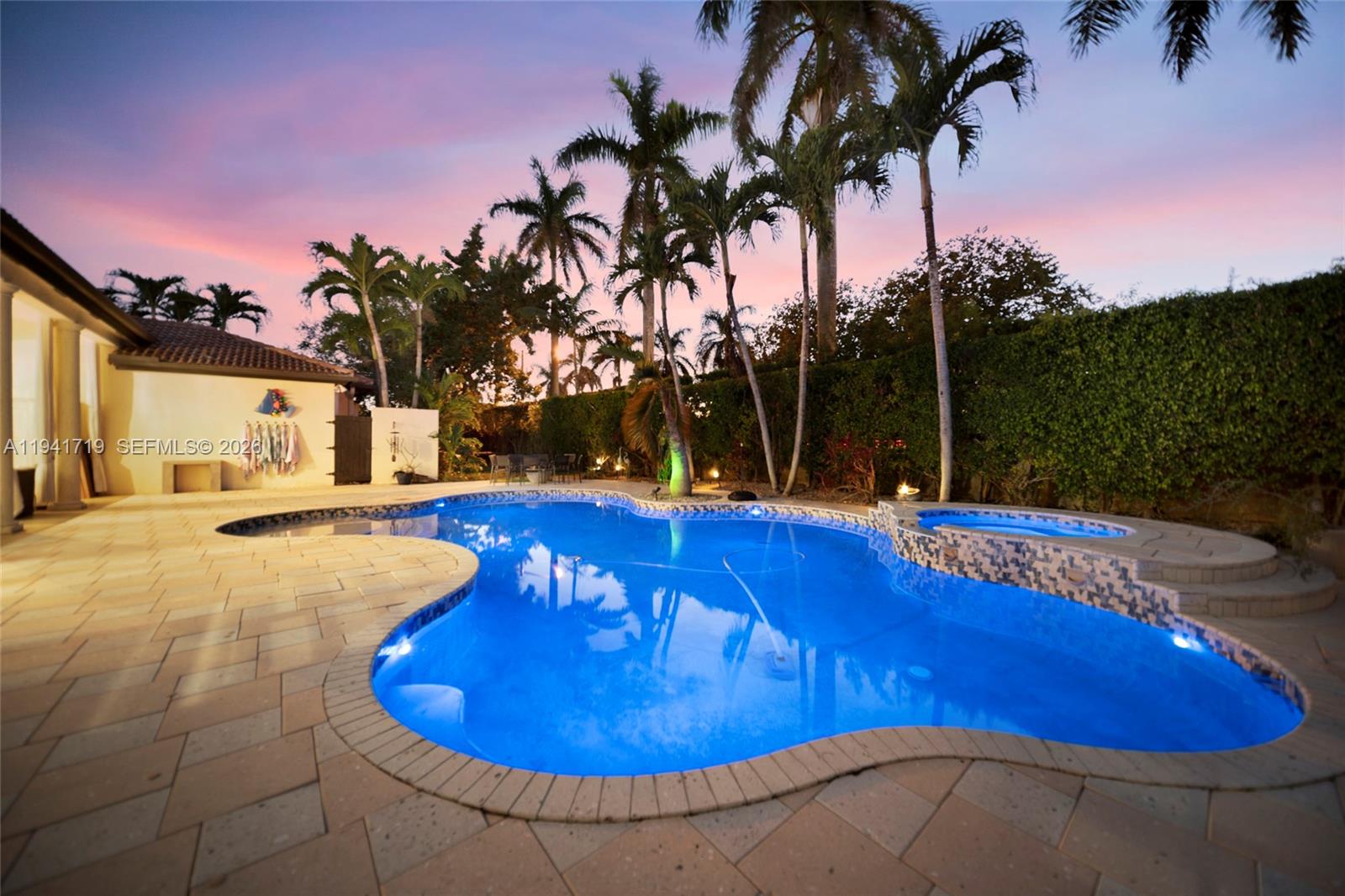 12530 Southwest 96th Court Miami, FL 33176 - Photo 69 of 82 a view of a swimming pool with an outdoor space and seating area