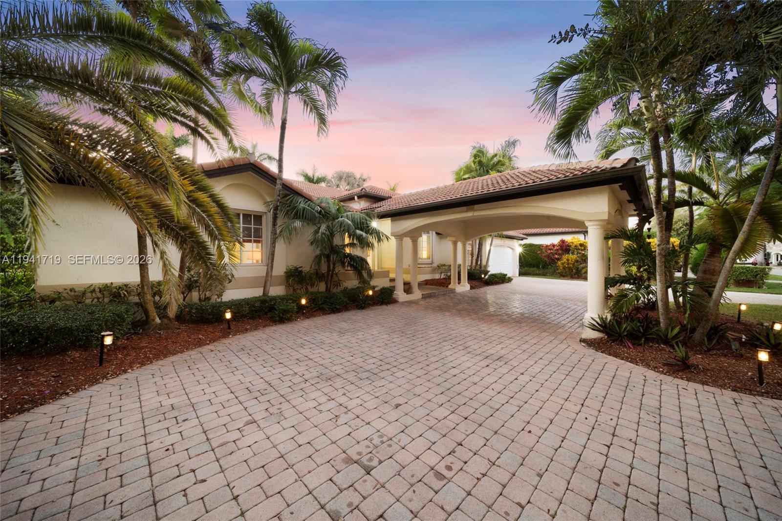 12530 Southwest 96th Court Miami, FL 33176 - Photo 7 of 82 a front view of a house with a yard and garage