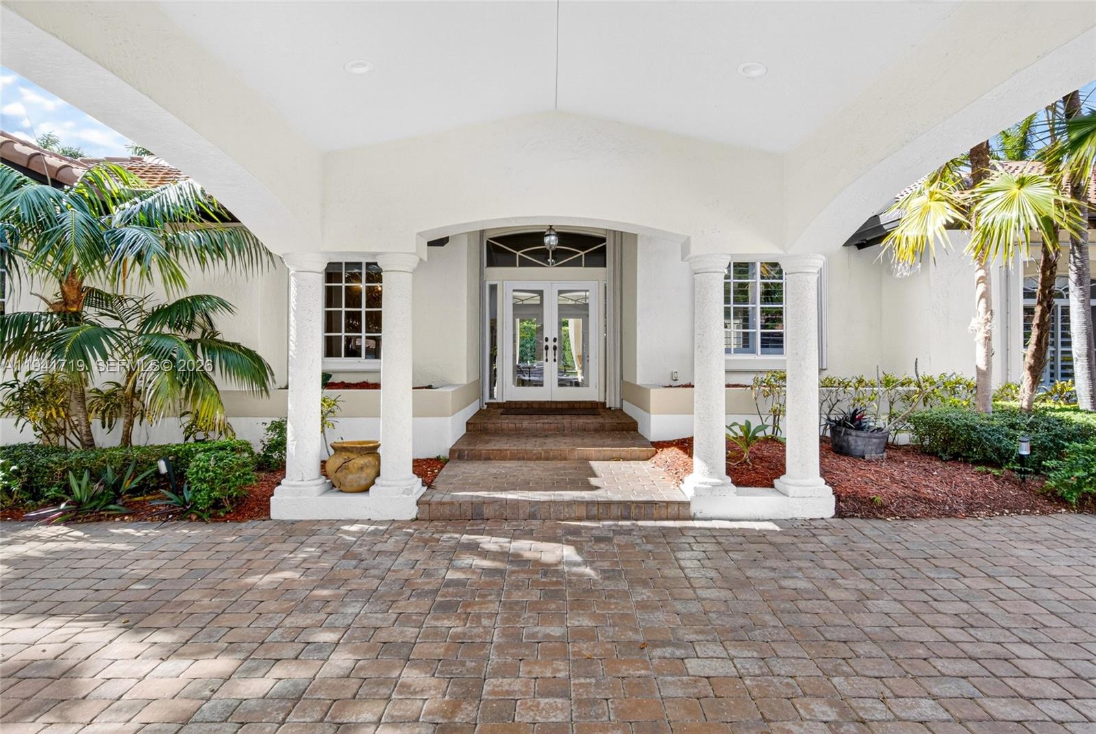 12530 Southwest 96th Court Miami, FL 33176 - Photo 9 of 82 a front view of a house with a porch