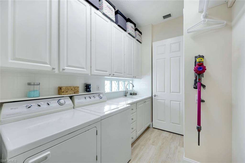 3108 Dominica Way Naples, FL 34119 - Photo 20 of 39 Dedicated laundry area featuring a built-in sink.