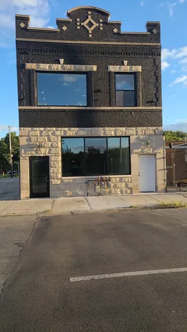 a view of building with yard