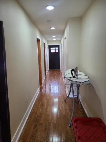 a view of wooden floor and brick wall