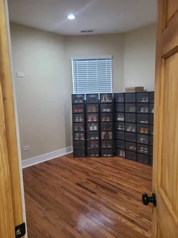 a bathroom with a sink and mirror with bathtub