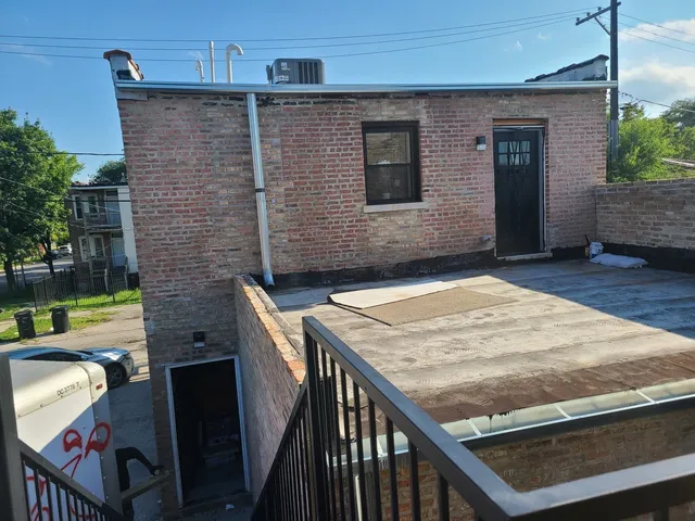 a view of a house with a street