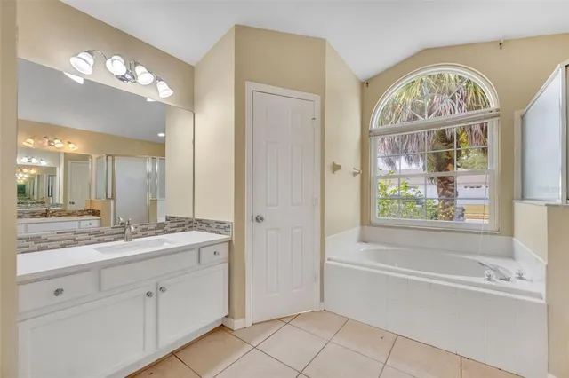 an empty room with closet and fan