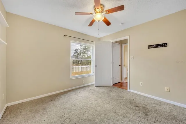 a bathroom with a sink a toilet and large mirror