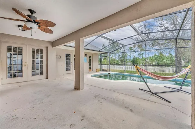 a view of a swimming pool with a patio