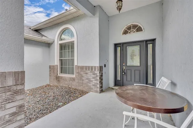 a view of a livingroom with furniture and staircase