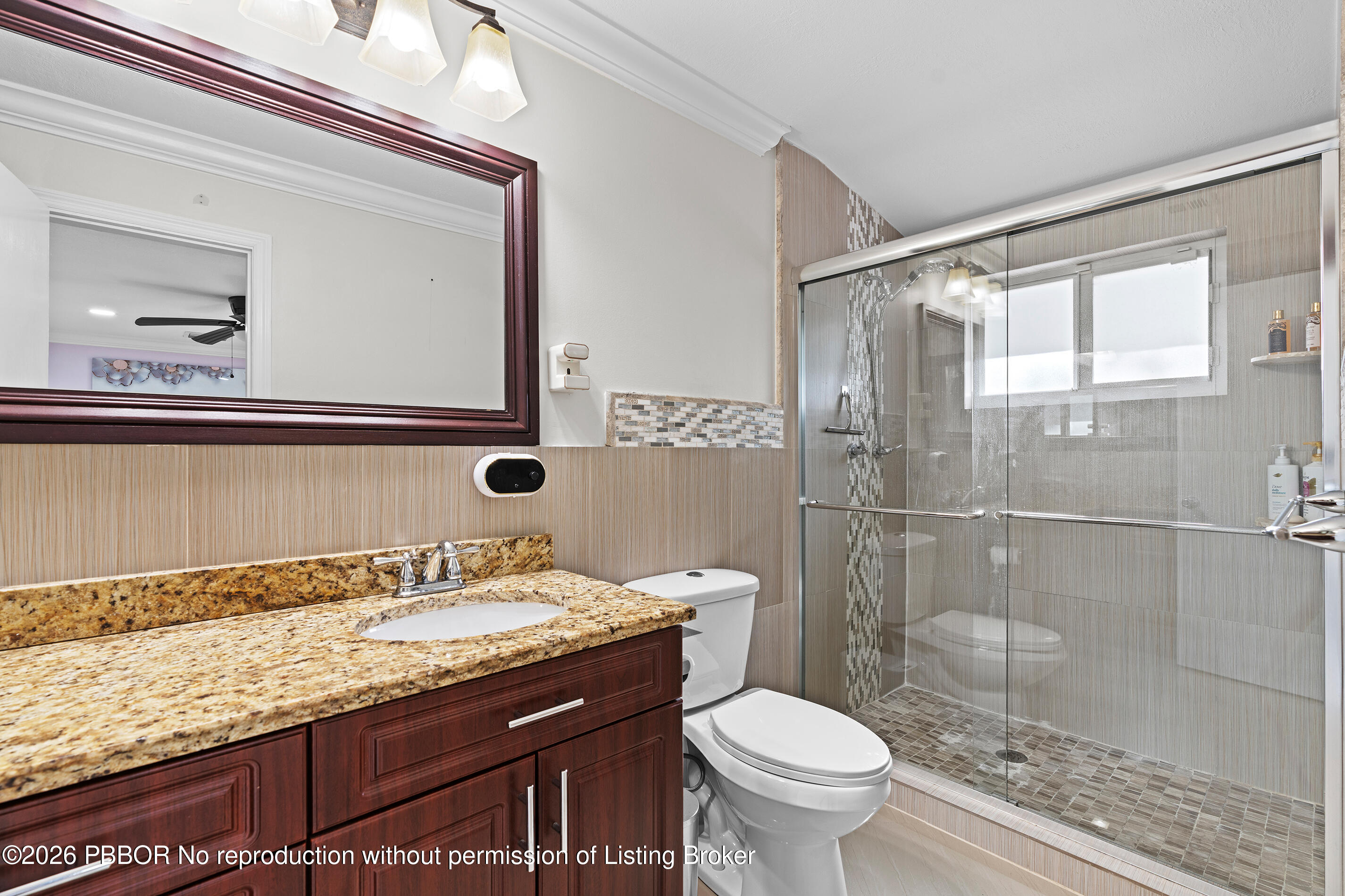 747 Avon Road West Palm Beach, FL 33401 - Photo 12 of 29 a bathroom with a granite countertop sink toilet and shower