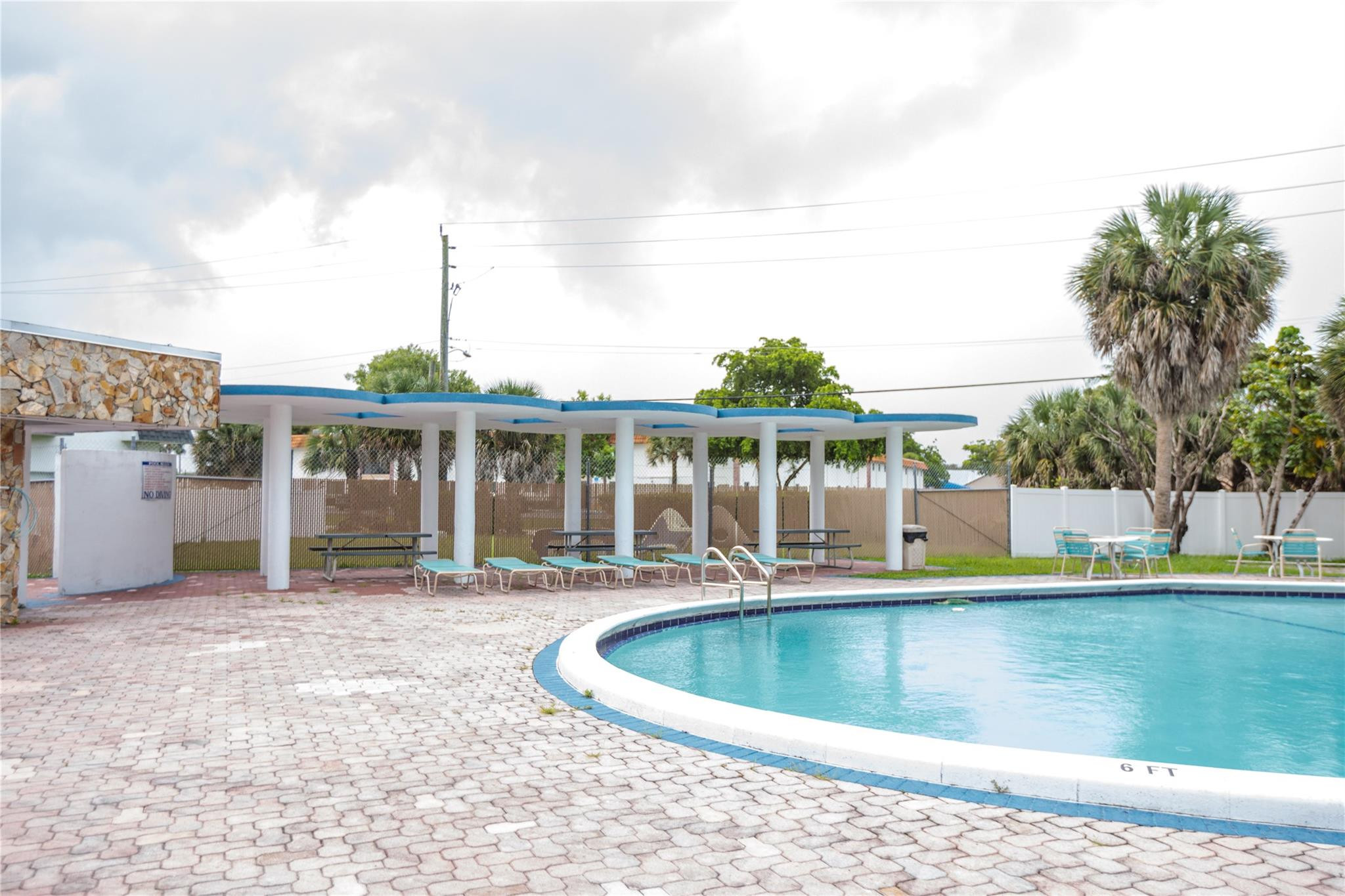 6764 Southwest 40th Street, Unit 40 Davie, FL 33314 - Photo 16 of 17 a view of a house with pool and sitting area