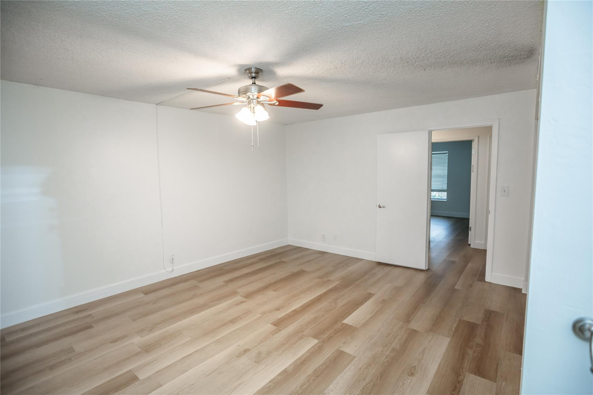 6764 Southwest 40th Street, Unit 40 Davie, FL 33314 - Photo 17 of 17 a view of empty room with wooden floor