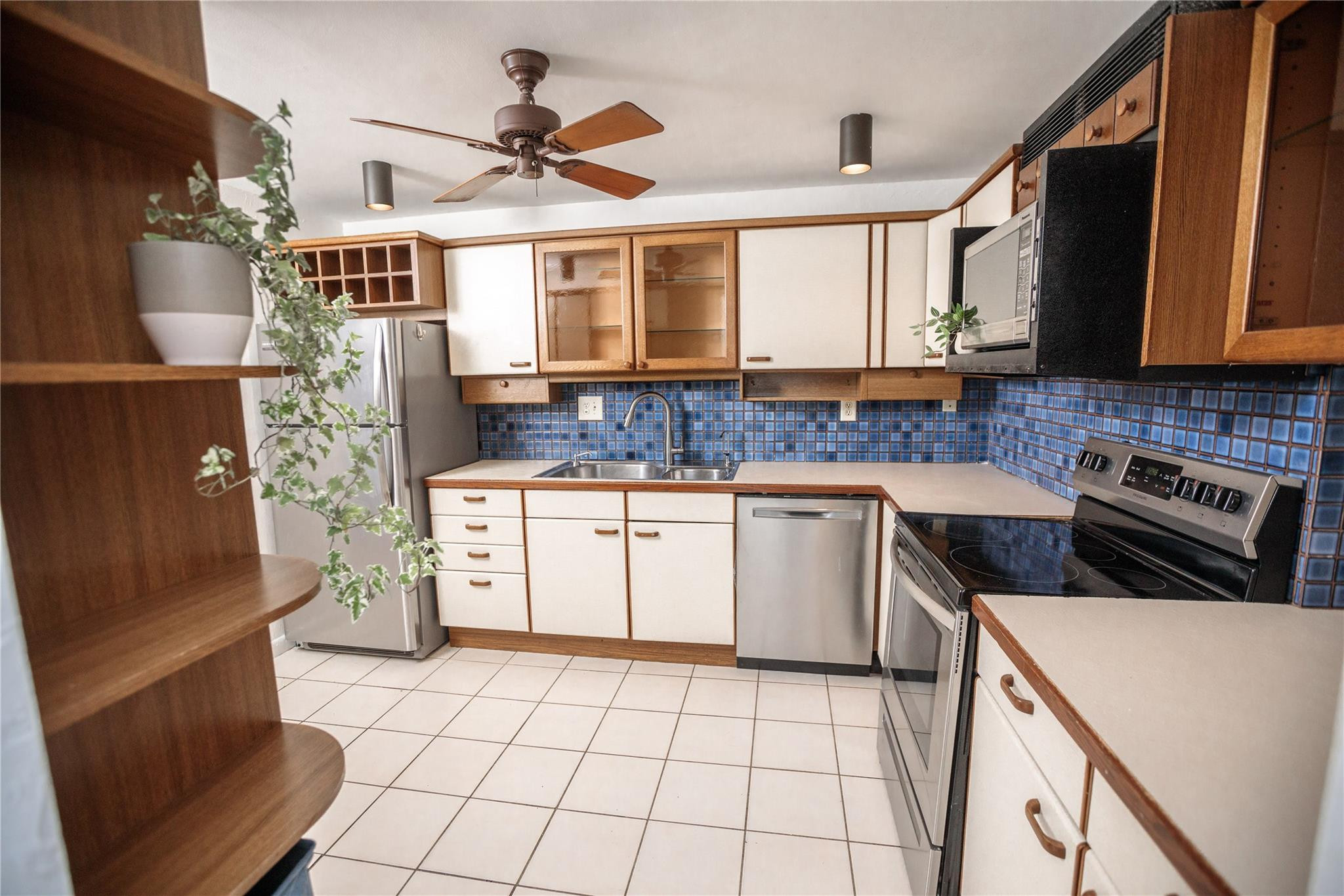 6764 Southwest 40th Street, Unit 40 Davie, FL 33314 - Photo 6 of 17 a kitchen with a sink stove and microwave