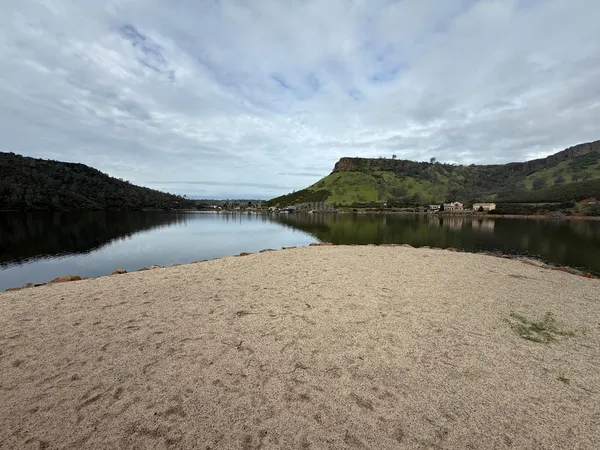 an aerial view of a house with lake view