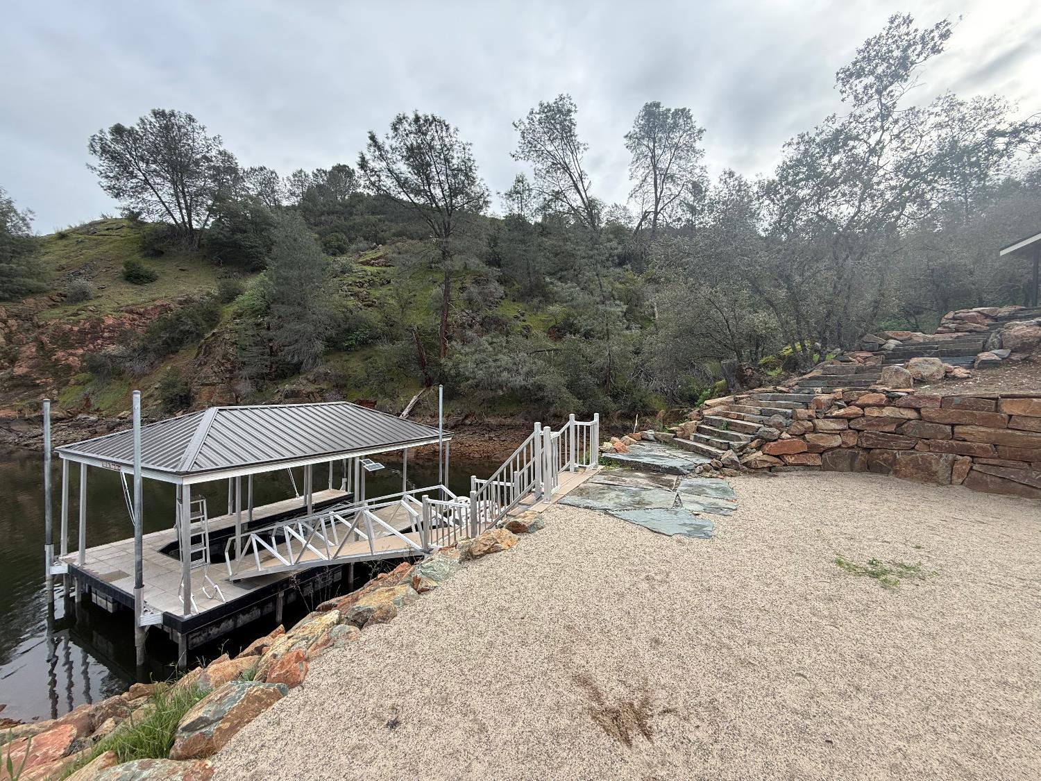 15000 Old O'Byrnes Ferry Road Jamestown, CA 95327 - Photo 14 of 62 a view of a house with a wooden deck and trees