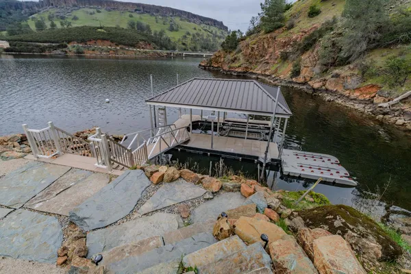 a view of a lake with houses in the back